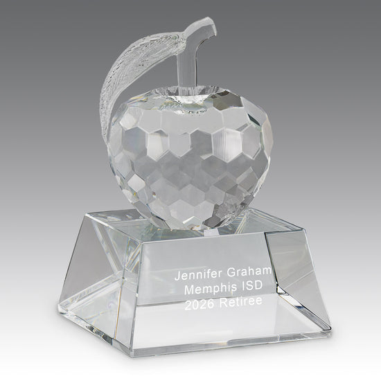 Faceted crystal apple, with leaf attached, to a flawless optic crystal base with smooth beveled
edges.