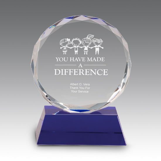 Faceted optic crystal award with blue base, 3.5x1.875x5 inches, etched for educator recognition.