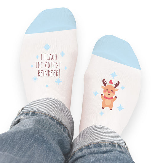 socks with i teach the cutest reindeer message