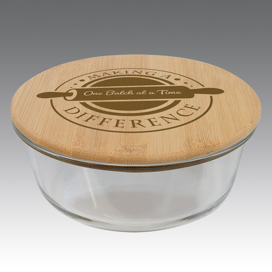 32-ounce glass storage container with round bamboo lid, featuring inspirational teacher message.