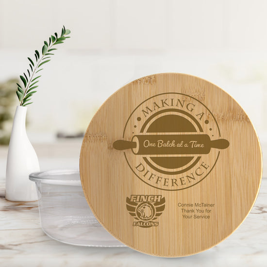 round glass storage container with bamboo lid, featuring making a difference message