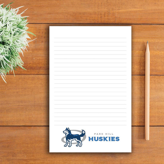 large notepad with custom logo sitting on a table