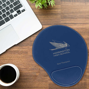 blue leather mouse pad with custom logo sitting on a desk