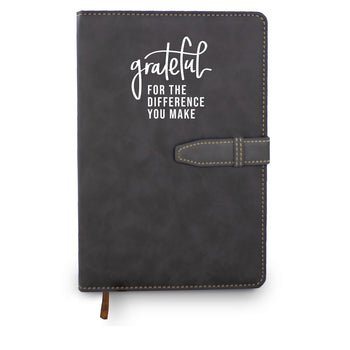 Hardbound journal with tab and loop closure. Cover reads: Grateful For The Difference You Make