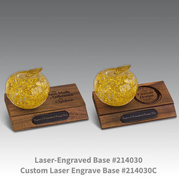 laser engraved walnut bases with black brass plates and handblown 23k gold apples
