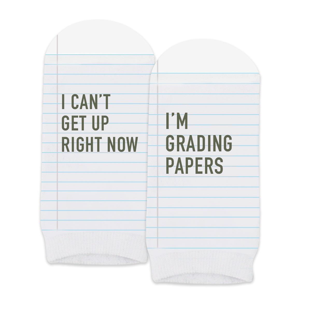 pair of no-show white socks with i can't i'm grading papers message