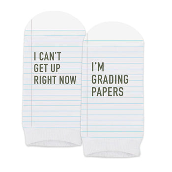 pair of no-show white socks with i can't i'm grading papers message