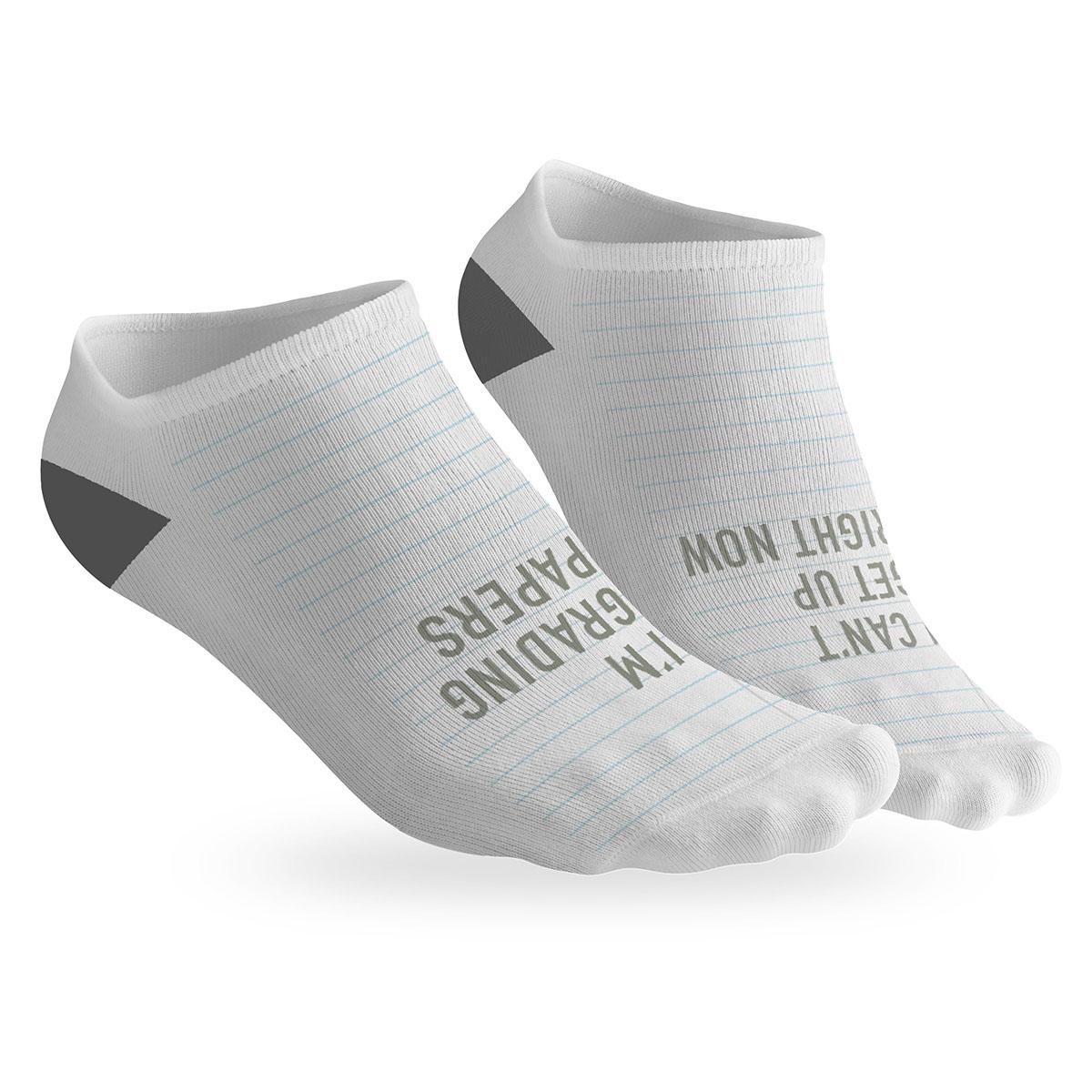 pair of no-show socks with a black heel and i can't i'm grading message on top.
