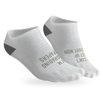 pair of no-show socks with a black heel and i can't i'm grading message on top.