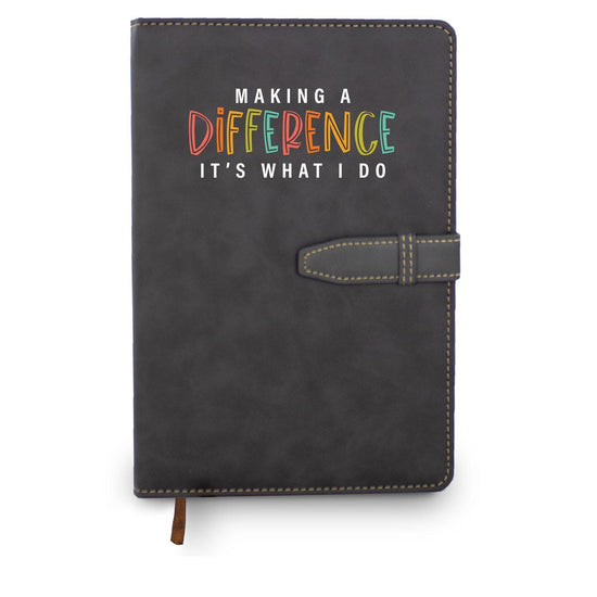 Hardbound journal with tab and loop closure. Cover reads: Making A Difference It's What I Do