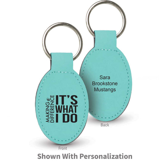 teal oval leather keychains with making a difference message and personalizaton