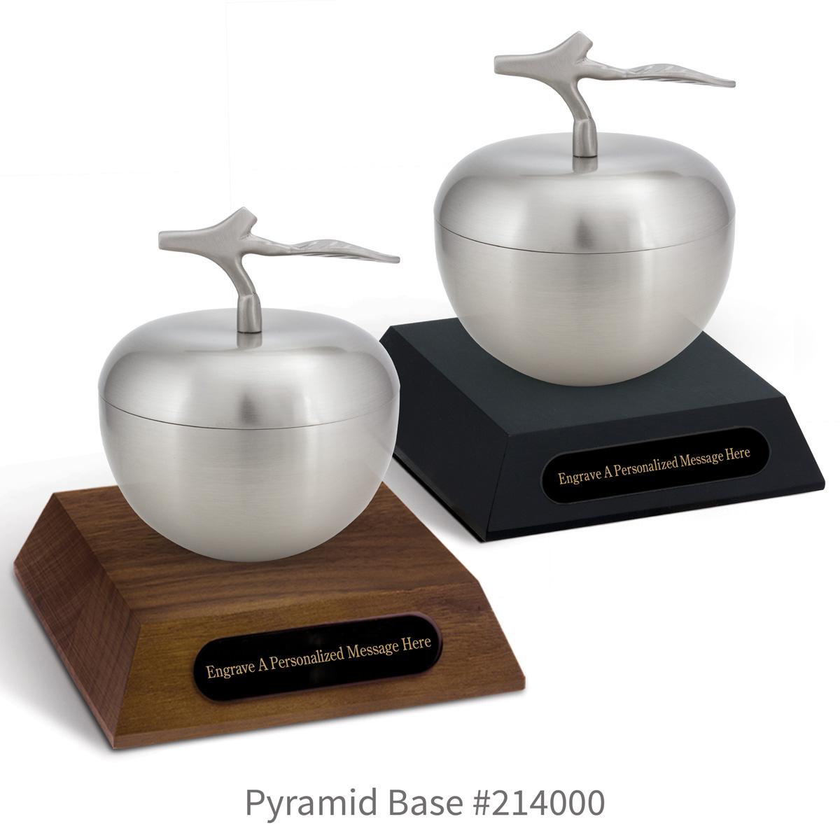 black and a brown walnut pyramid bases with black brass plates and silver apple dishes