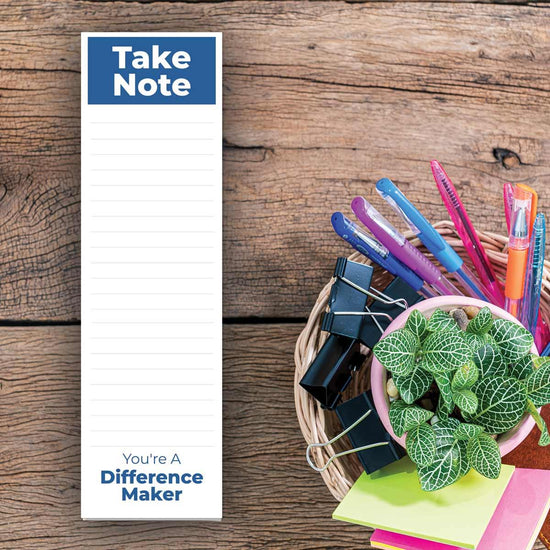 take note notepad sitting on a desk