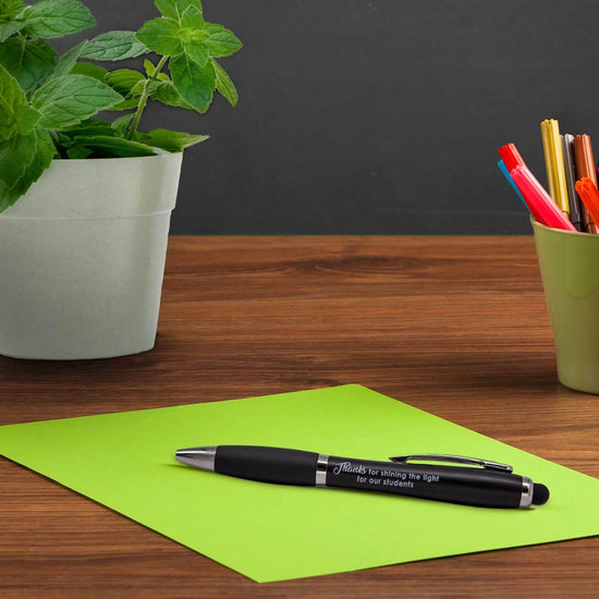 black pen with thanks for the shining the light message sitting on a desk