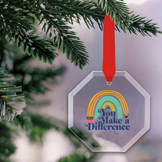 octagon shaped crystal ornament with make a difference message and red satin ribbon