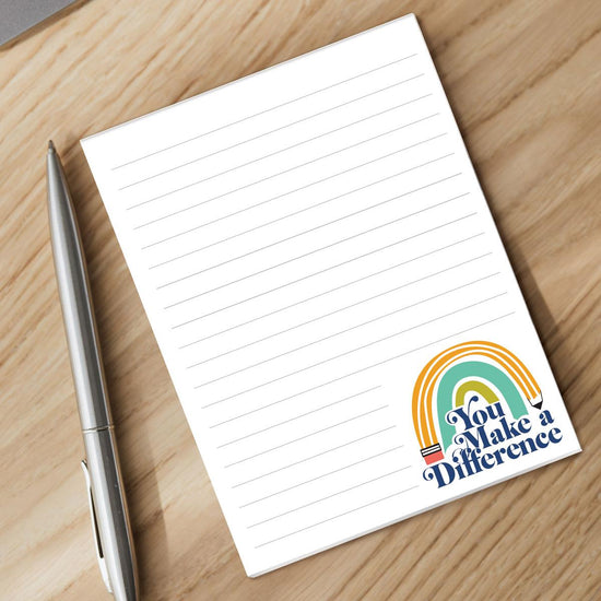 you make a difference notepad with a pen sitting on a desk