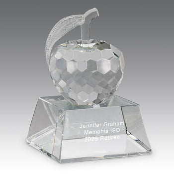 Faceted crystal apple, with leaf attached, to a flawless optic crystal base with smooth beveled 
edges. 