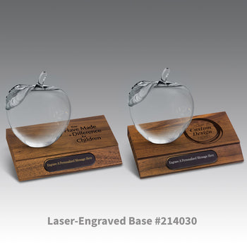 laser-engraved bases with black brass plates and crystal apples