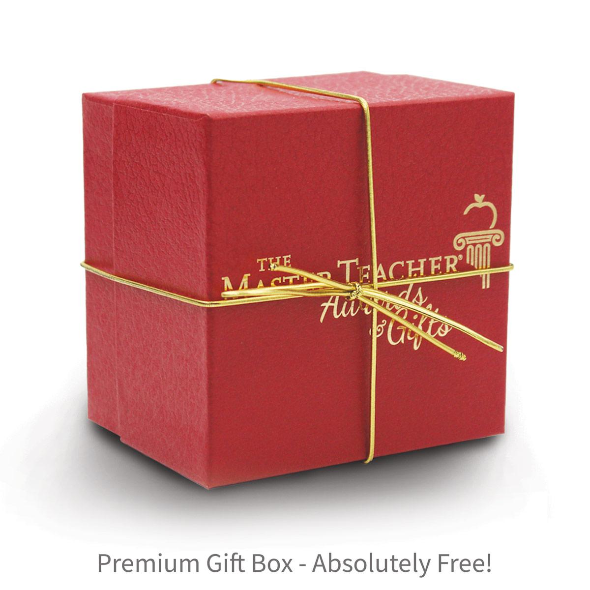 red gift box with gold elastic bow and The Master Teacher logo