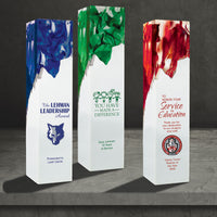 Acrylic square tower award featuring a white base and blue, green, or red swirls. Includes educational recognition message.   