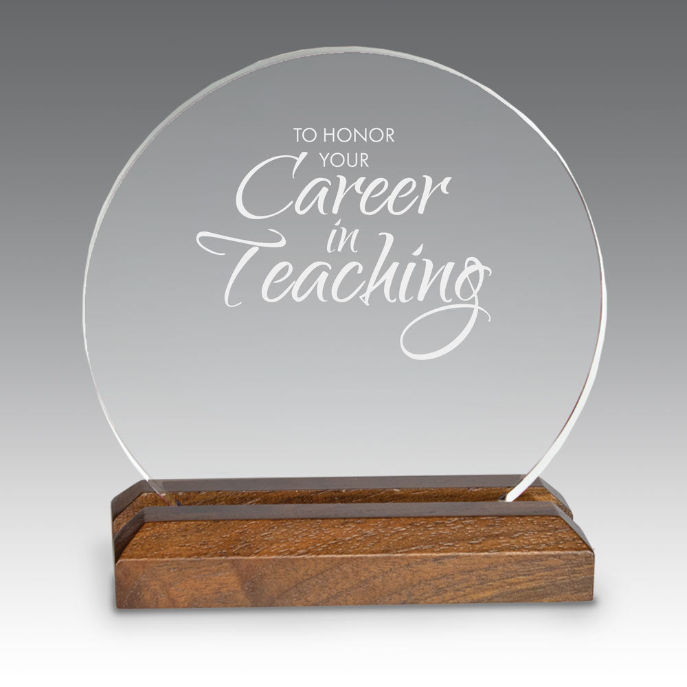 Round acrylic award with walnut base, featuring career in teaching message
