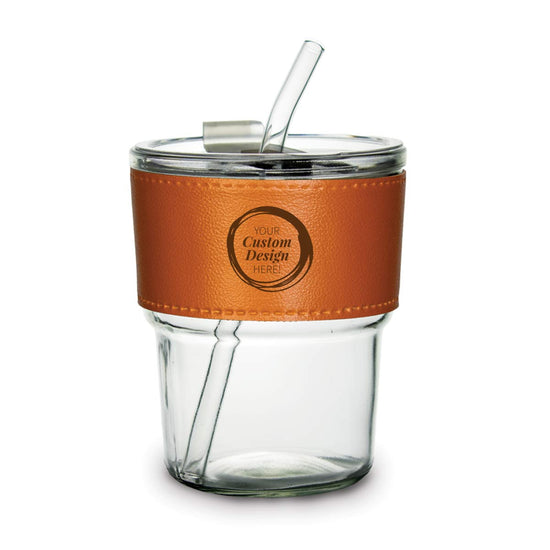 13-ounce glass tumbler with lid and glass straw, featuring a removable leather sleeve for custom engraving.