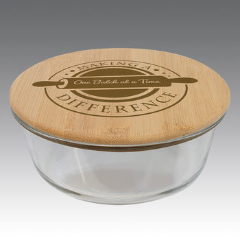 32-ounce glass storage container with round bamboo lid, featuring inspirational teacher message.
