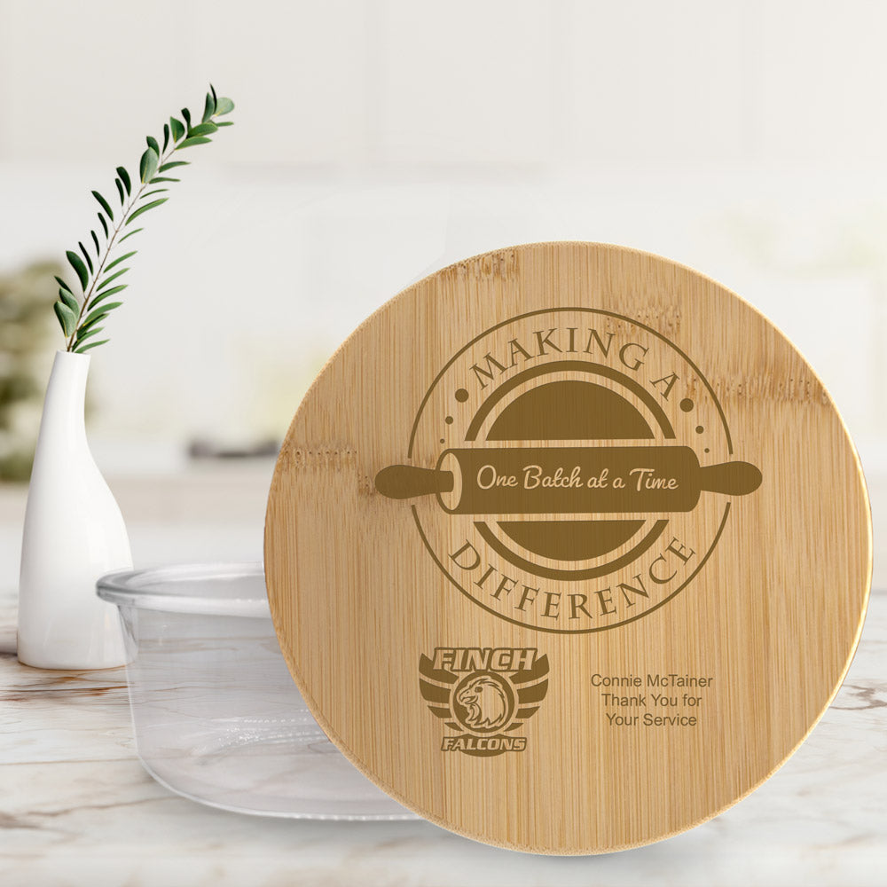 round glass storage container with  bamboo lid, featuring making a difference message