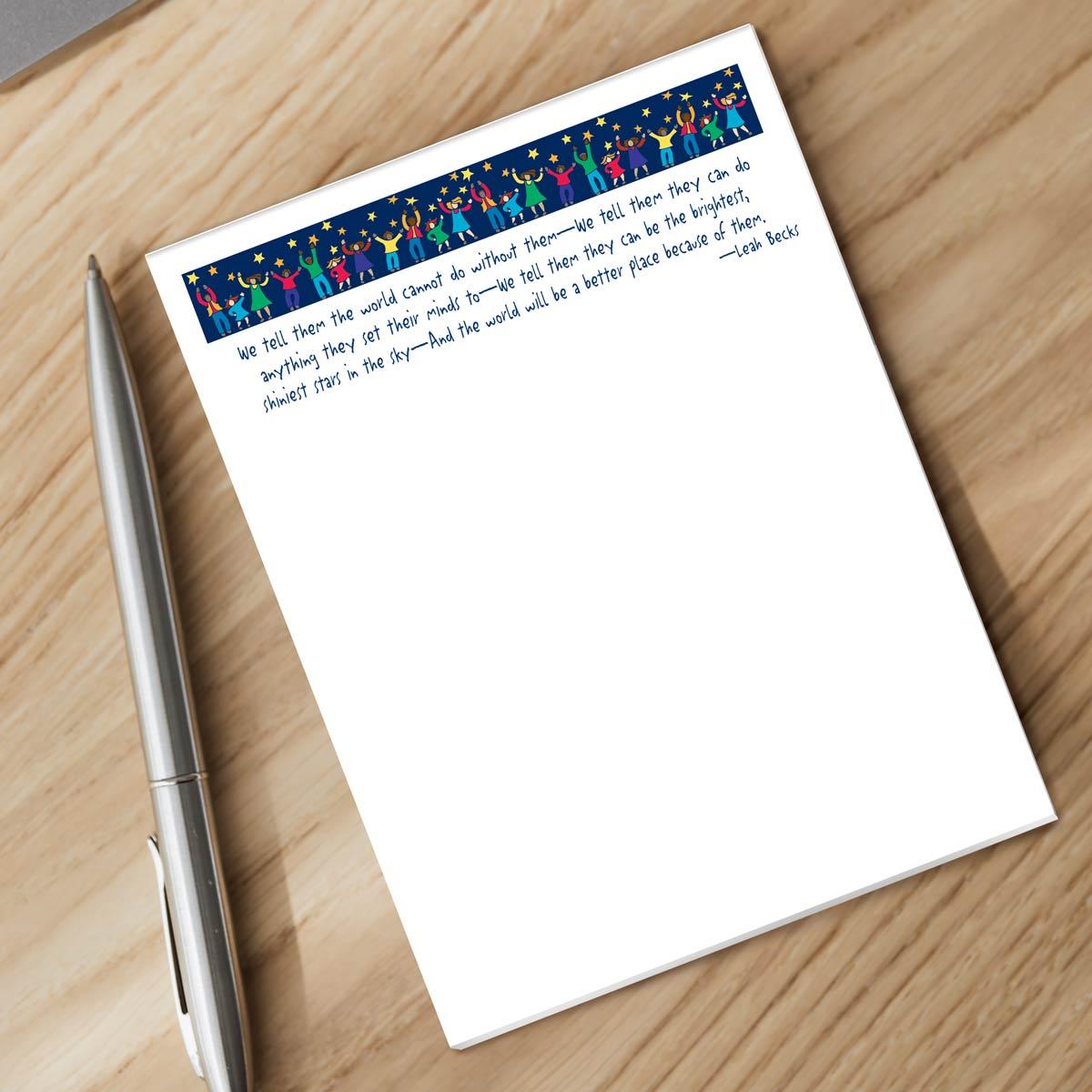 star polisher notepad and silver pen sitting on a desk