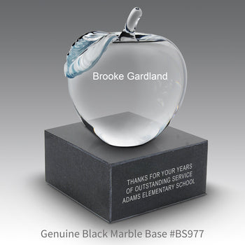 personalized crystal apple sitting on top a black marble base with personalization