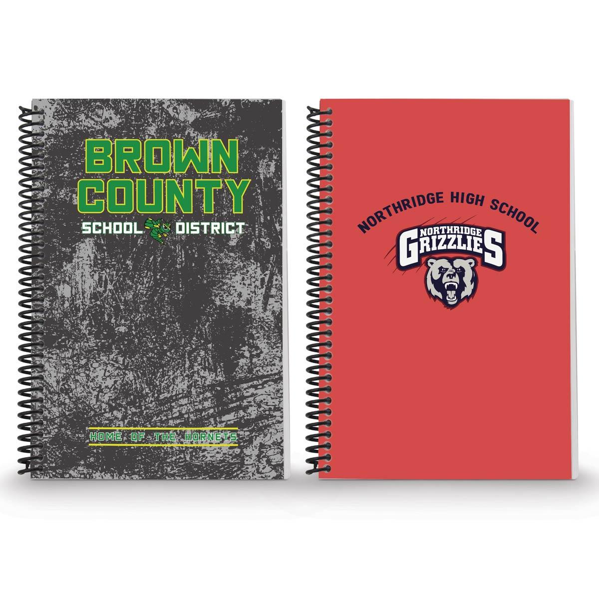 two spiral journals with custom logos