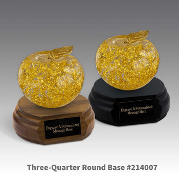 black and a brown walnut three-quarter round bases with black brass plates and 23k gold apples