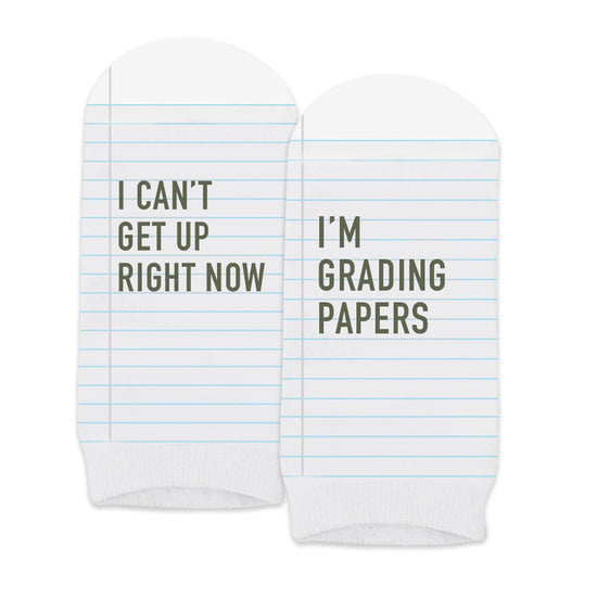 pair of no-show white socks with i can't i'm grading papers message