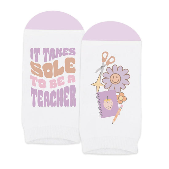 pair of no-show white socks with it takes sole to be a teacher message