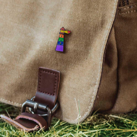 light house lapel pin on canvas bag