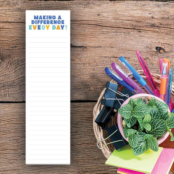 making a difference every day notepad sitting on a desk