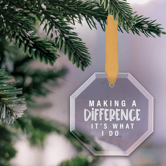 octagon shaped crystal ornament with making a difference message and gold satin ribbon