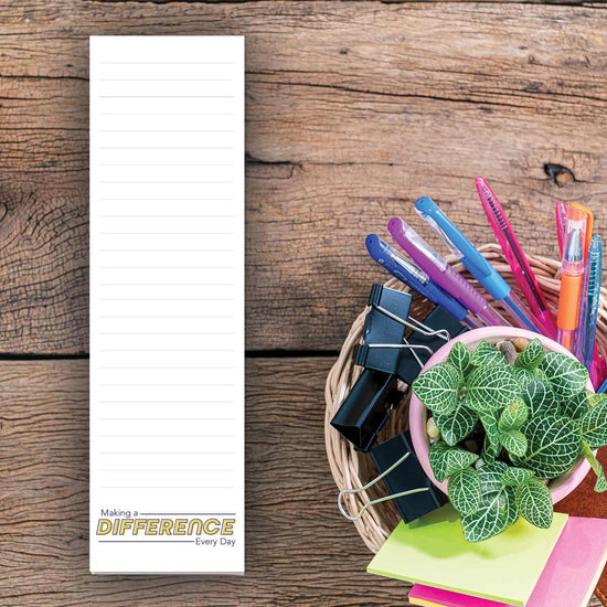 making a difference every day notepad sitting on a desk