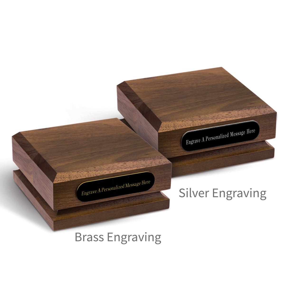 two walnut pedstal bases with personalized black brass plates