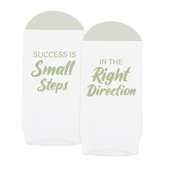 pair of no-show white socks with success in small steps message