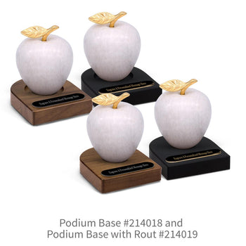 black and brown walnut podium bases with black brass plates and white marble apples