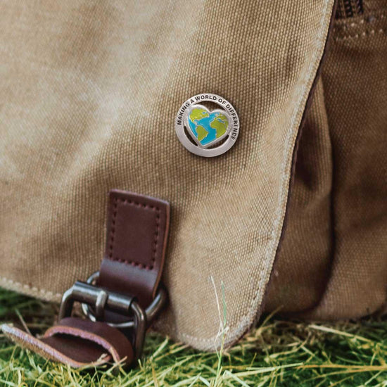 you make a world of difference lapel pin on canvas bag