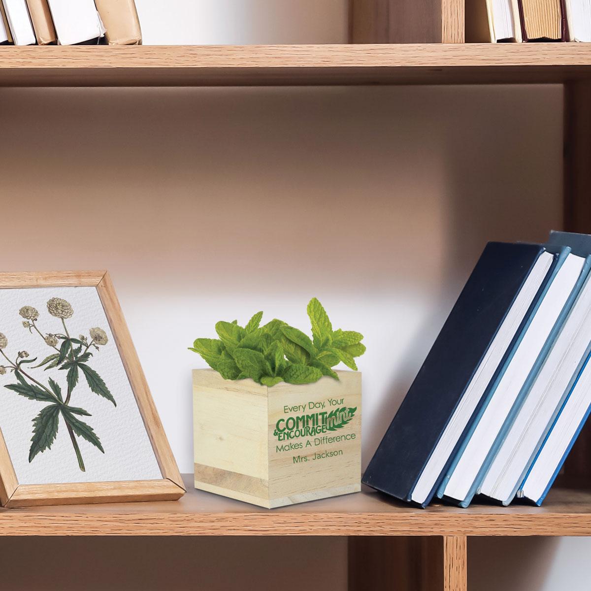 commit-mint wooden cube sitting on a shelf