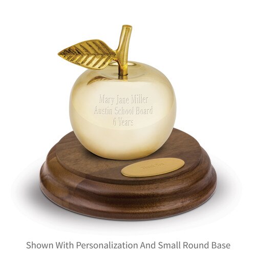 personalized brass apple bell sitting on top a walnut base with brass plate