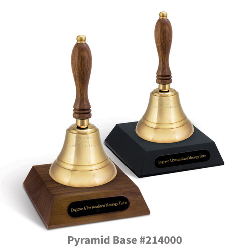 black and a brown walnut pyramid bases with black brass plates and brass bells
