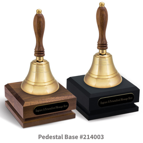 black and a brown walnut pedestal bases with black brass plates and brass bells