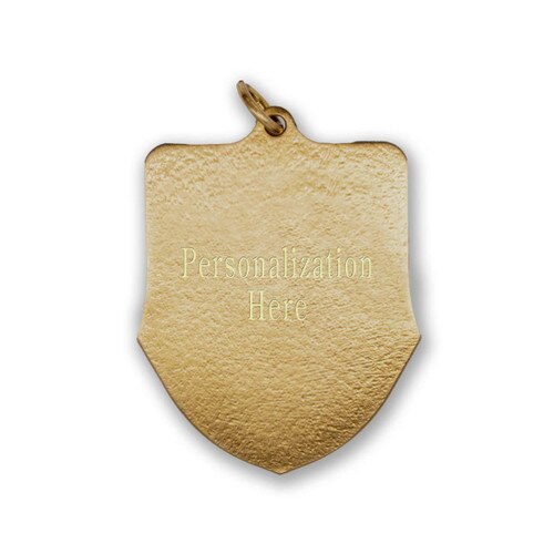 back side of brass shield medal with engraving