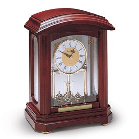 bulova nordale solid wood clock with walnut finish and brass-toned rotating pendulum