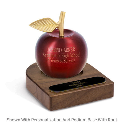 personalized crimson finished brass apple bell sitting on top a walnut base with brass plate