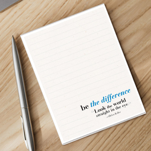 be the difference notepad and silver pen sitting on a desk